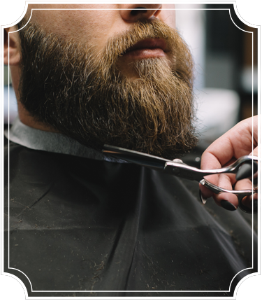 Man in barbershop getting his beard trim
